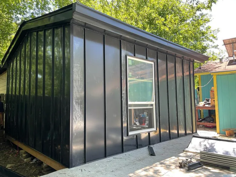 Black standing seam metal wall panels for Roof Inspection in Collier