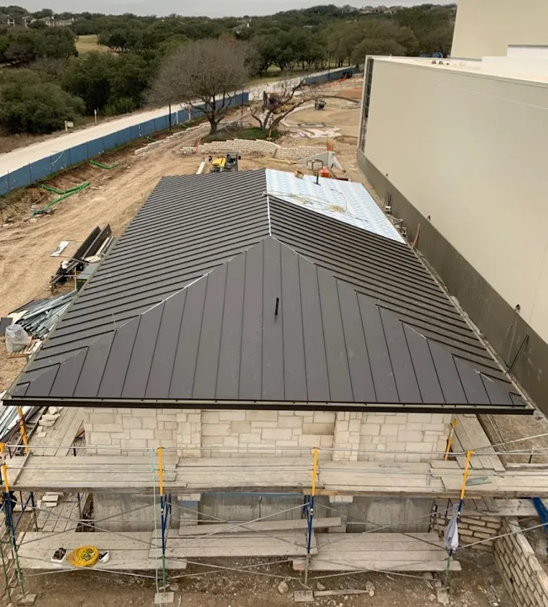 Metal roof new construction with scaffolding in Collier